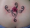 small flower tats on lower back